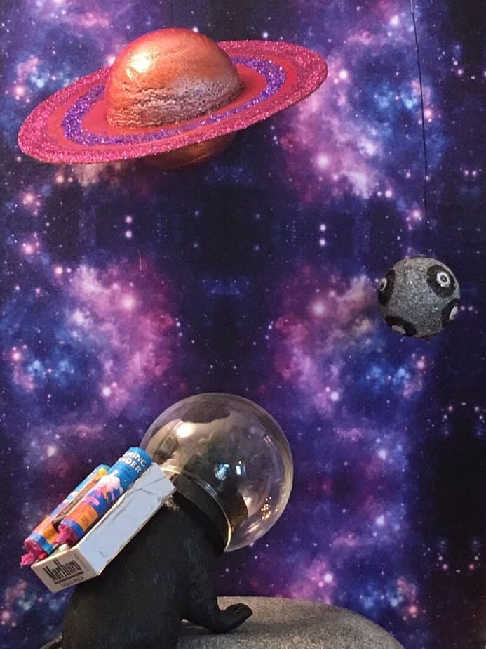Rat in spacesuit with planets
